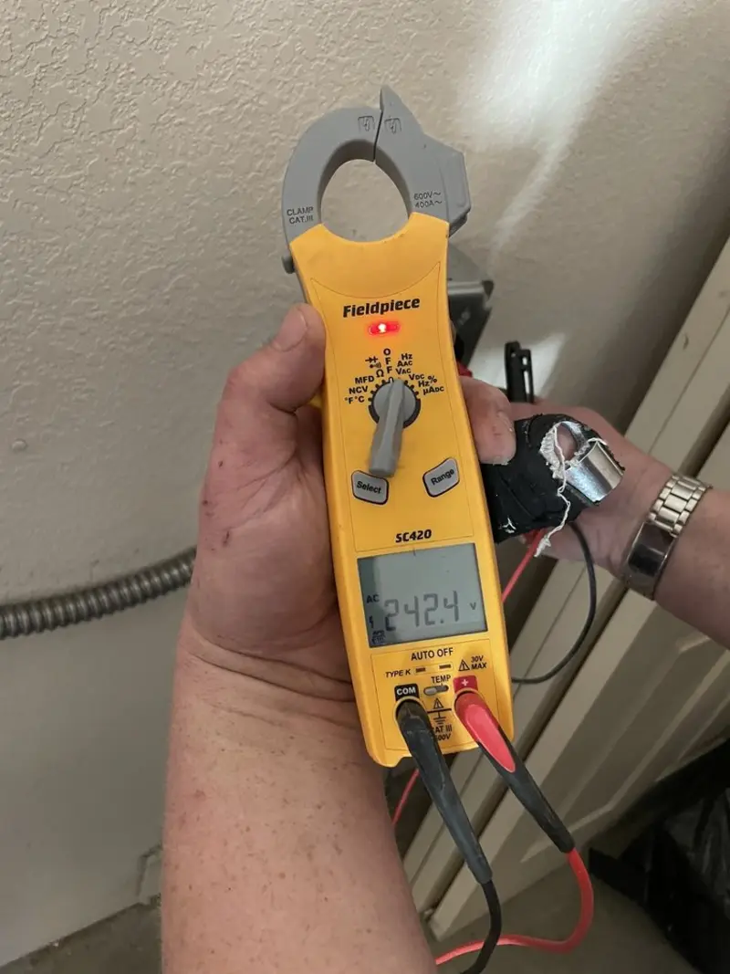 Voltage testing with clamp meter during Outlet Installation in Mount Pleasant